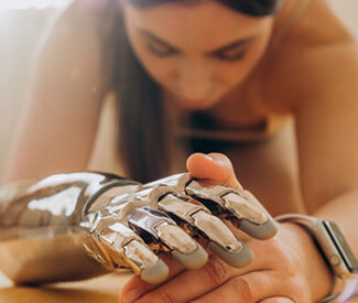 Individual with a prosthetic hand designed to meet their needs. This assistive technology is part of FAAST public awareness and training campaign