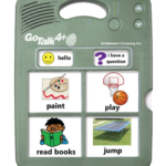 Green Rectagular plastic device with 4 large communcation buttons and 2 smaller communication buttons