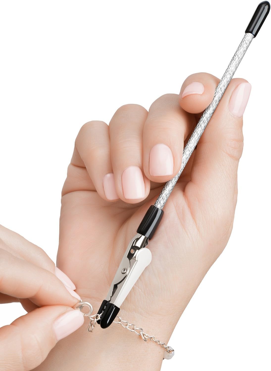 Pencil sized metal tool with clasp to hold bracelet in place