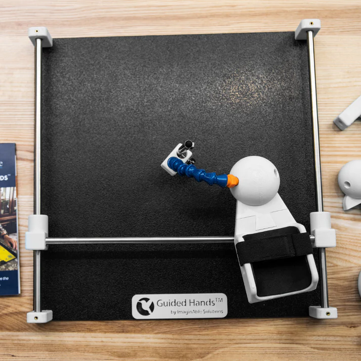 Black desktop platform with a 2 way track with handpiece to hold tool